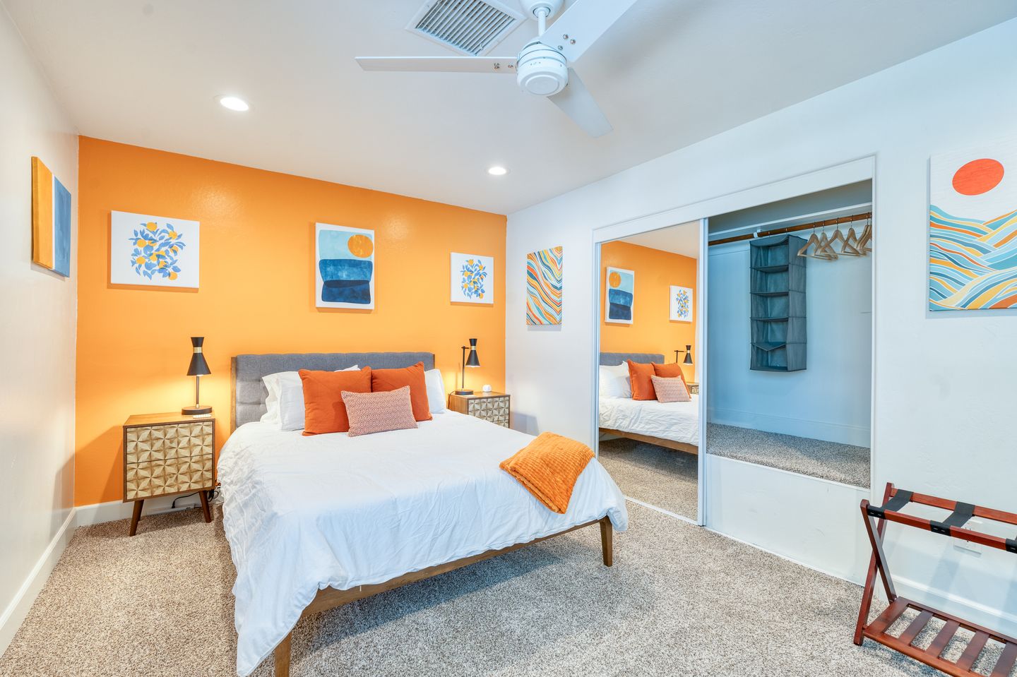 Angled view of the Mandarin Bedroom queen bed and closet