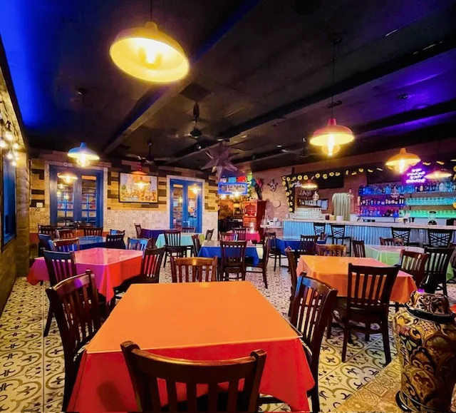 Bright tablecloths, patterned tile, and colorful lights fill La Tablita’s dining room.
