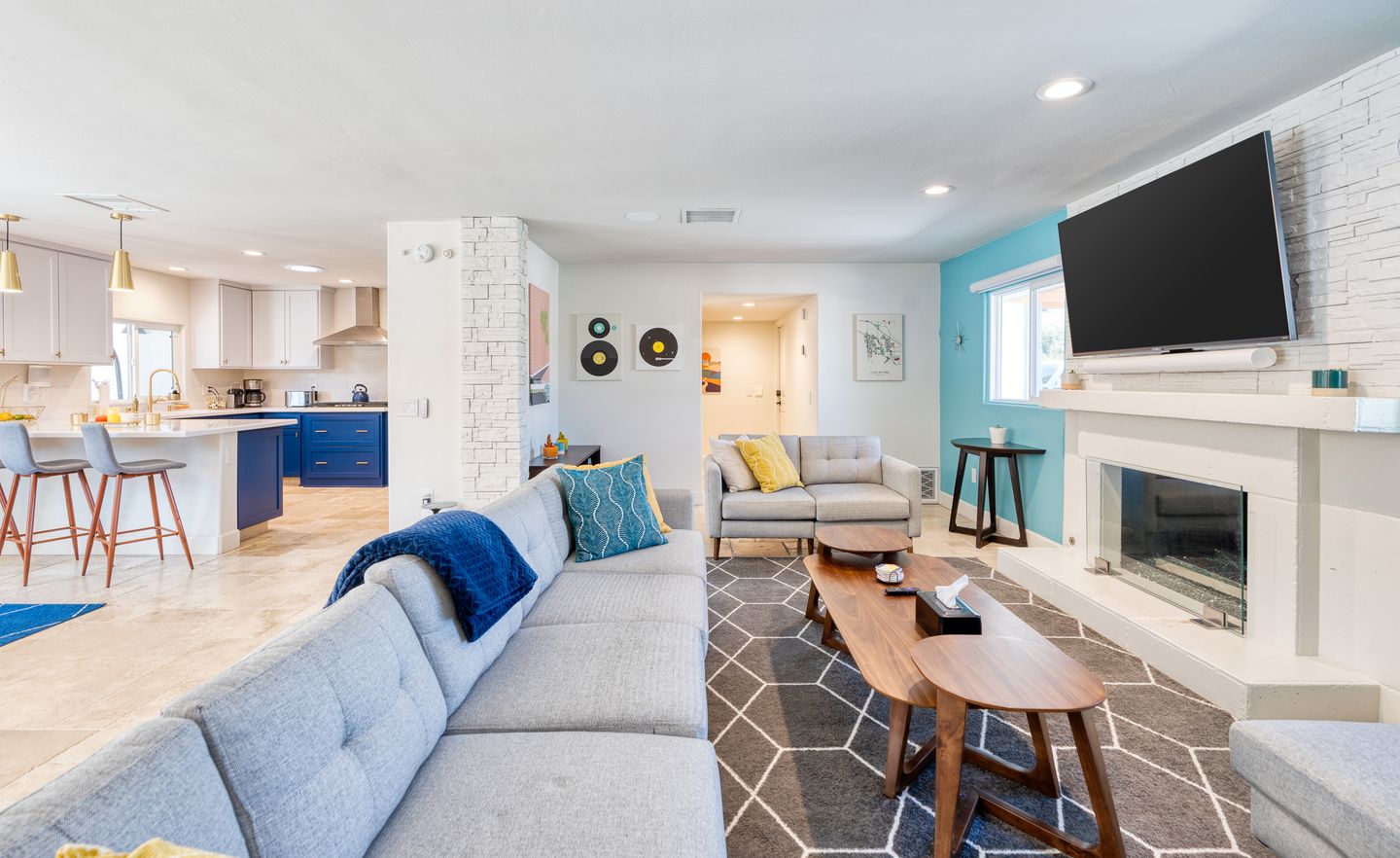 Colorful living room with fireplace and 65-inch smart television