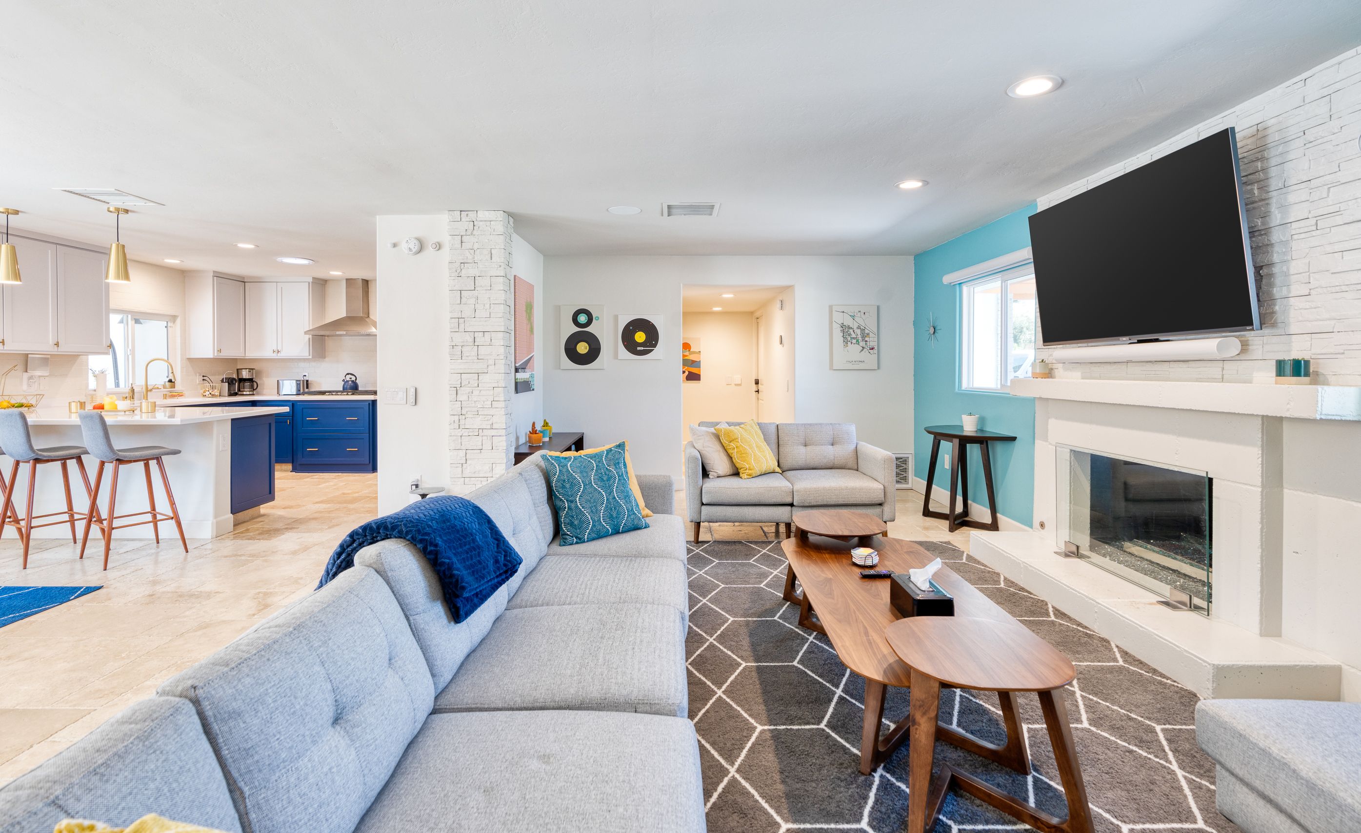 Colorful living room with fireplace and 65-inch smart television