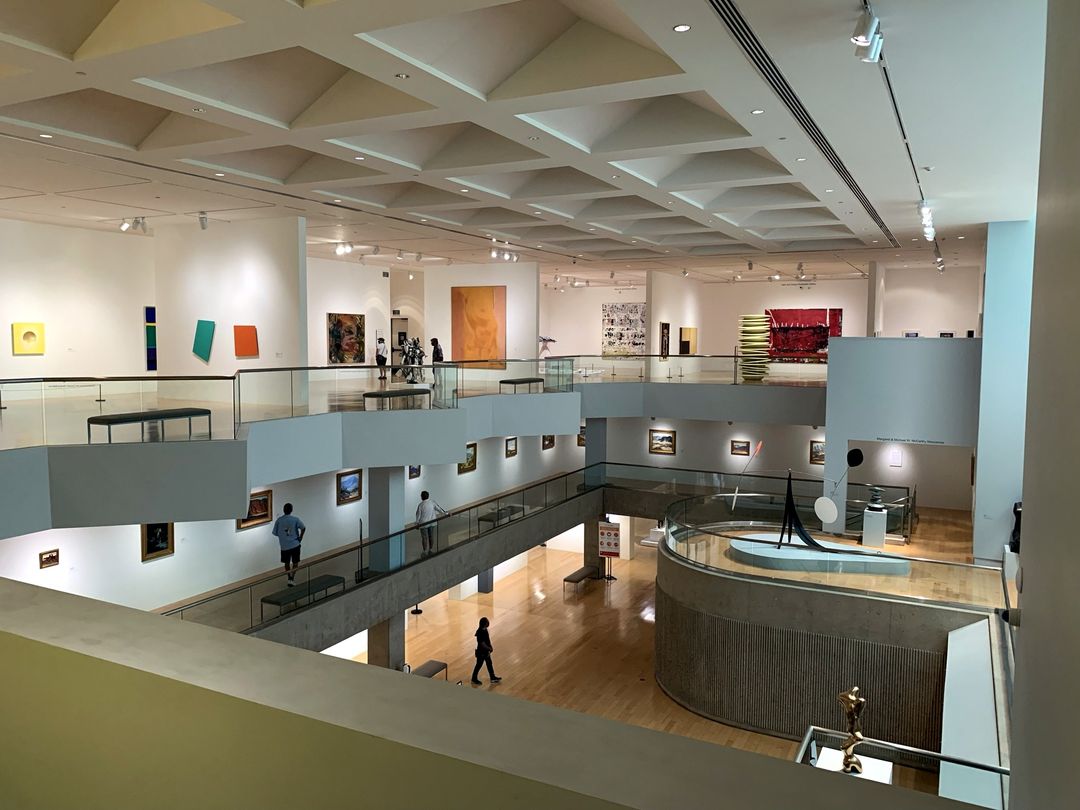 Palm Springs Art Museum interior with artworks displayed across its open, multi-level galleries.